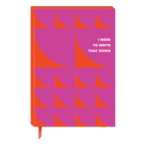 Red softcover journal for recording thoughts, travel stories, and dreams.
