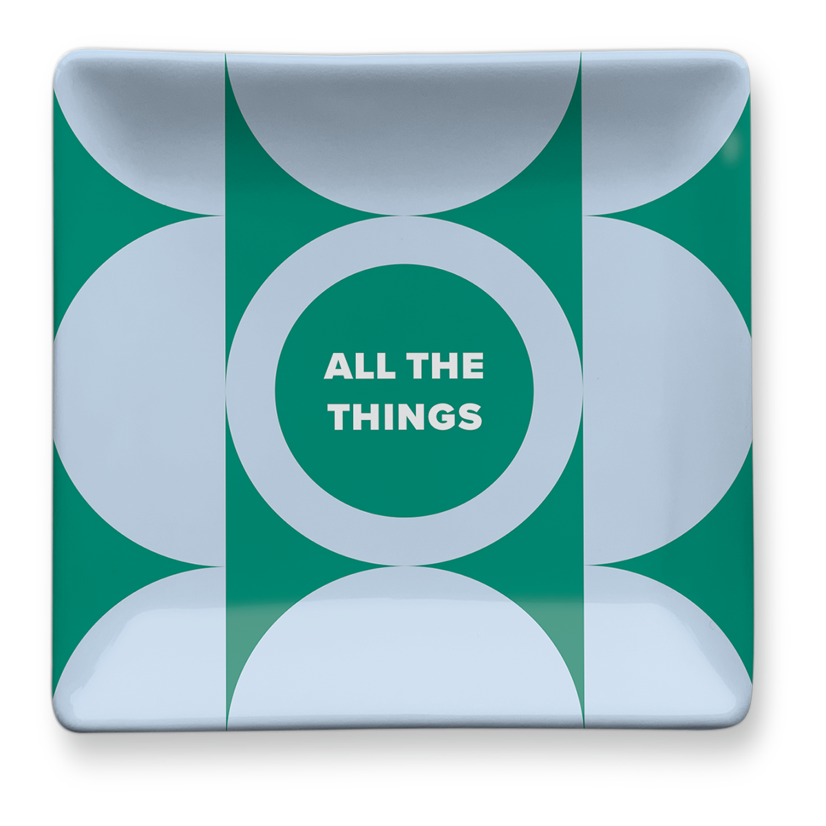 Green trinket tray for organizing keys and other essentials.
